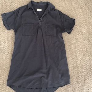 Black dress with pocket detail, super cute. Longer in back than front